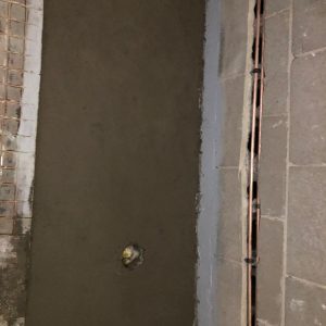 screed installed to create appropriate falls in the floor