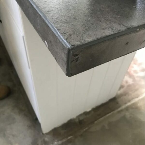 Close up of mitred corner with matching grey SMX Soudal Joint adhesive used for the voids between sheets