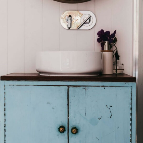 Vanity in exposed brick bathroom